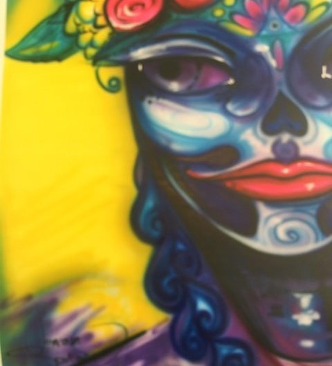 MASCARA OCULTA, mixed media by Jonas Soriano — blue calavera-marked face with red lips and red flowers on yellow.